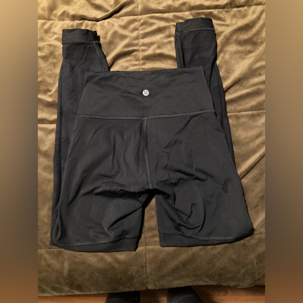 Lululemon brand, size 6, Black High-Waisted Leggings, sheer for half, cute desig